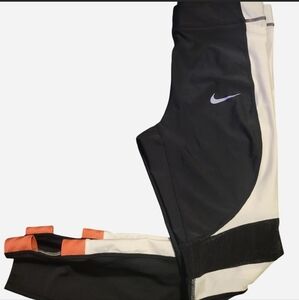 Nike Black and White Leggings with Vibrant Orange Details